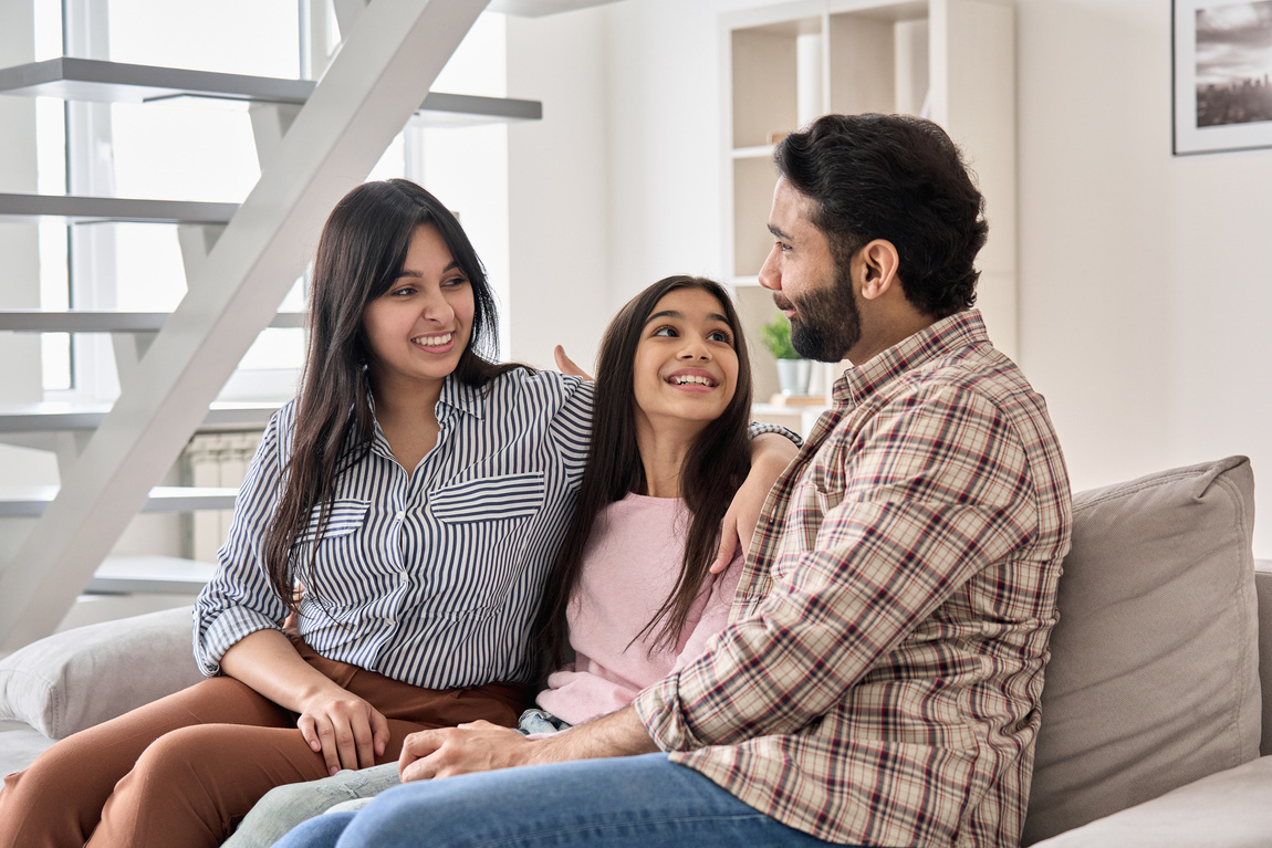 Parents Talking with Teen Daughter at Home